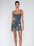 Midnight blue mini dress with flowing silhouette and sparkling accents for evening events