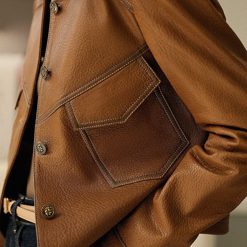 Women leather jacket with distinctive collar and pockets button closure
