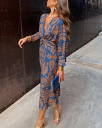 Women's boho maxi dress with V-neckline and twist front detail, full-length boho print