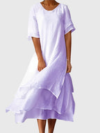 Women's elegant dress with open neckline and fluid cut, available in multiple colours