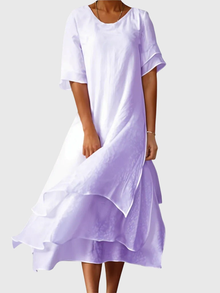 Women's elegant dress with open neckline and fluid cut, available in multiple colours