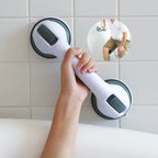 Bathroom safety grab bar with suction cups mounted on tile wall for senior support