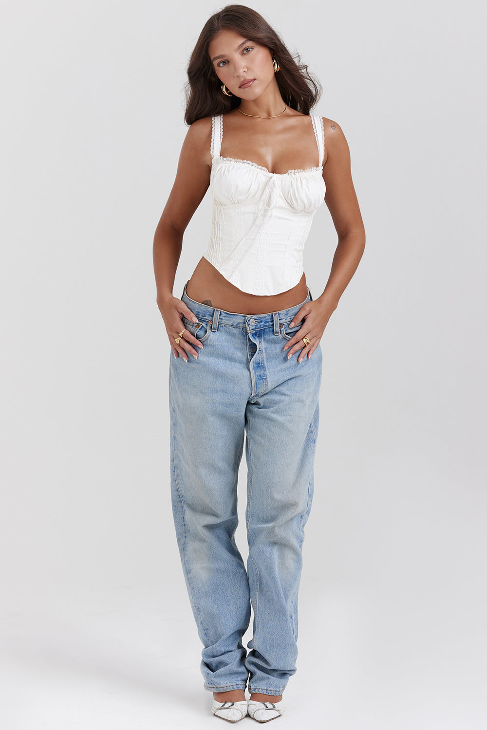 Women white lace-up corset top with delicate lace straps and ruched bust