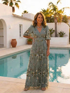 Green floral maxi dress with V neckline and elbow-length sheer sleeves