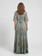 Green floral maxi dress with V neckline and elbow-length sheer sleeves
