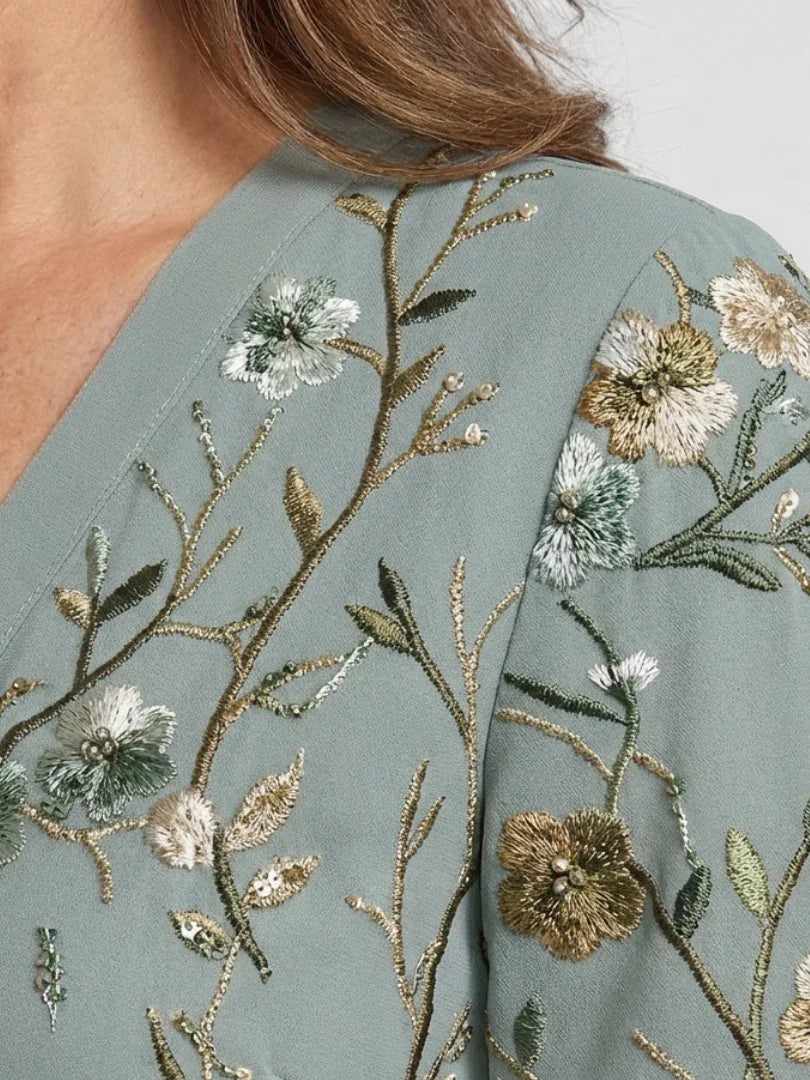 Green floral maxi dress with V neckline and elbow-length sheer sleeves