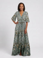 Green floral maxi dress with V neckline and elbow-length sheer sleeves