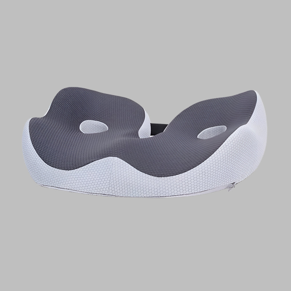 Memory foam seat cushion with ergonomic sit bone and tailbone cut-out relief design