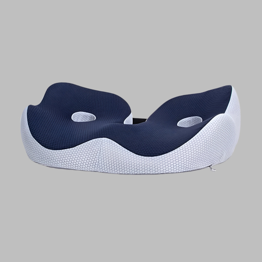 Memory foam seat cushion with ergonomic sit bone and tailbone cut-out relief design
