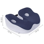 Memory foam seat cushion with ergonomic sit bone and tailbone cut-out relief design