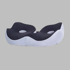 Memory foam seat cushion with ergonomic sit bone and tailbone cut-out relief design