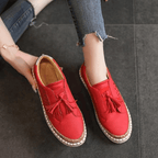 Women slip-on casual sneakers perforated upper with cork trim and tassel accents