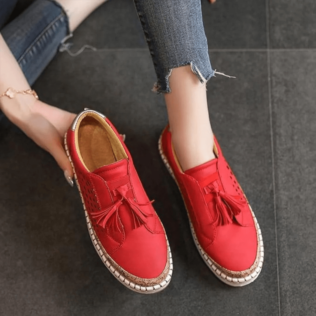 Women slip-on casual sneakers perforated upper with cork trim and tassel accents