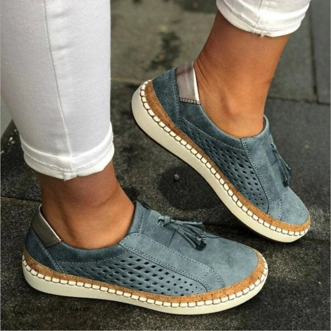 Women slip-on casual sneakers perforated upper with cork trim and tassel accents