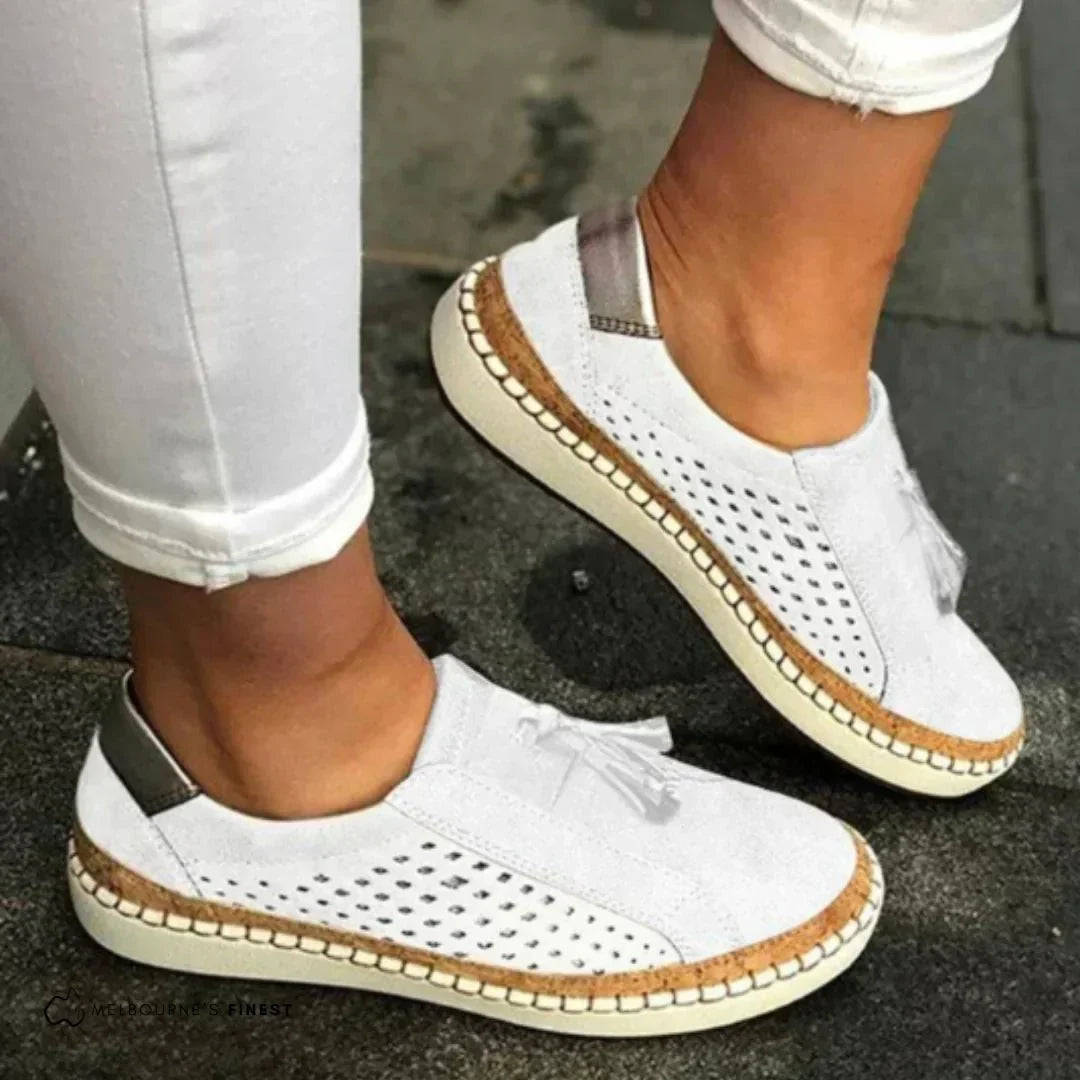 Women slip-on casual sneakers perforated upper with cork trim and tassel accents
