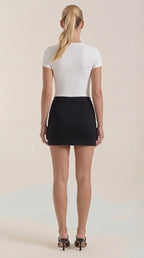 Women asymmetric wrap mini skirt in black, modern angled hem
