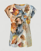 Women's summer blouse with watercolor floral print, asymmetric hem and relaxed loose fit