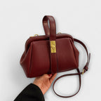 Women mini crossbody bag with twist lock closure in faux leather