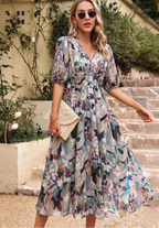 Floral midi dress with puff sleeves and flattering waist-tailored fit