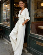 Women's wide-leg jumpsuit with V-neck and belted waist, elegant occasion wear