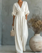 Women's wide-leg jumpsuit with V-neck and belted waist, elegant occasion wear