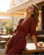 Women's wide-leg jumpsuit with V-neck and belted waist, elegant occasion wear