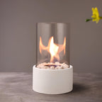 Decorative ethanol oil lamp with metal frame, glass cylinder, and decorative stones, indoor and outdoor