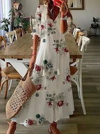 Women's boho dress with V-neckline and lantern sleeves, flowy A-line silhouette