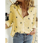 Women's long sleeve button-front blouse in printed and solid styles, relaxed fit