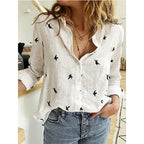 Women's long sleeve button-front blouse in printed and solid styles, relaxed fit