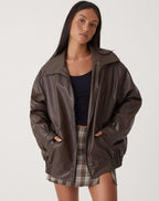 Women's oversized PU leather jacket in brown and black, relaxed fit streetwear style