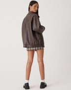 Women's oversized PU leather jacket in brown and black, relaxed fit streetwear style