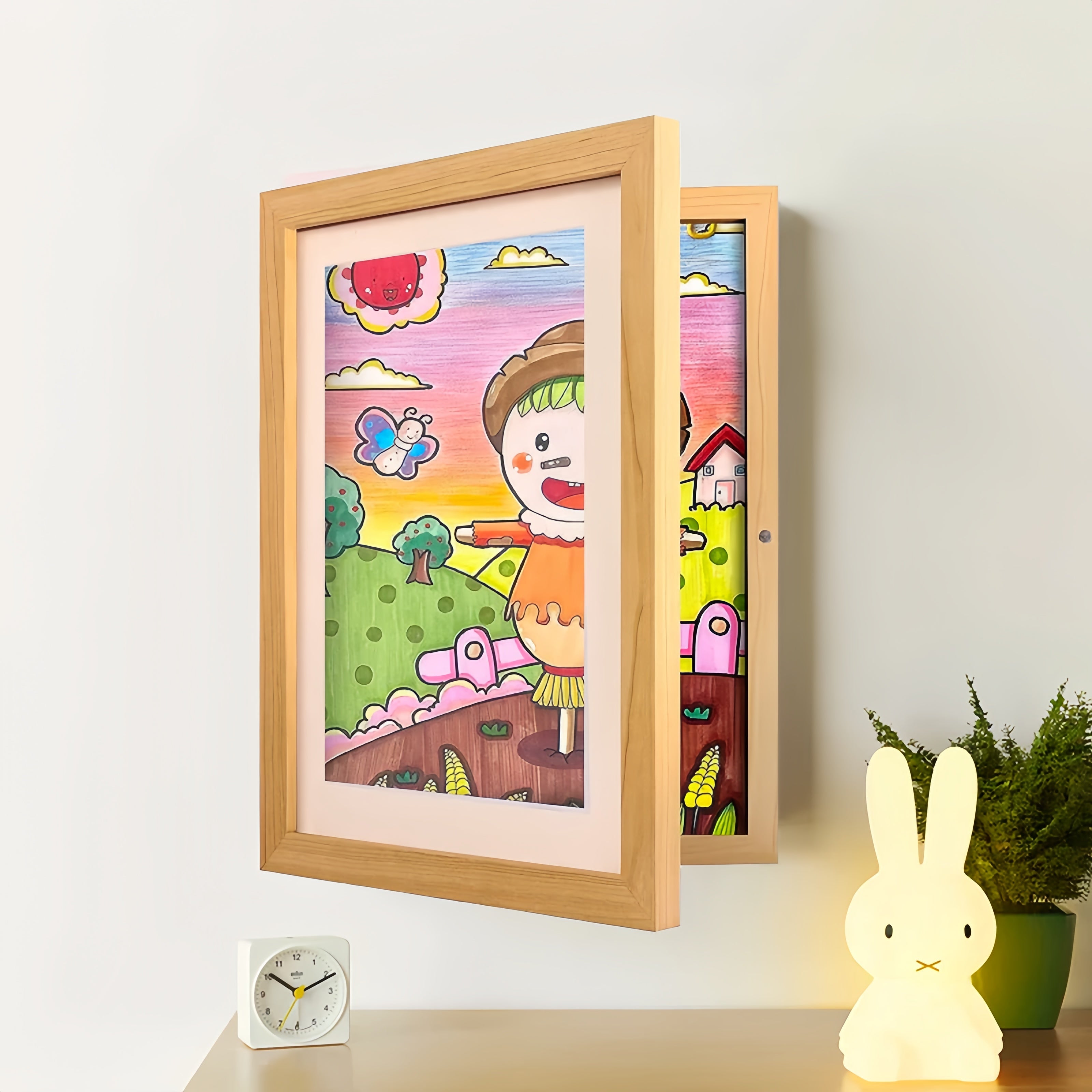 Kids drawing display frame rotating art frame stores 150 drawings, available in multiple colors