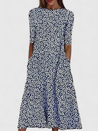 Women's floral midi dress with round neckline, stretchy fabric, available in blue and green
